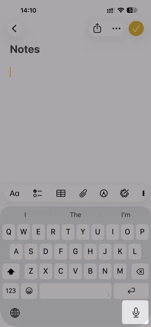 The dictation microphone key on the iPhone keyboard, bottom right next to the return key