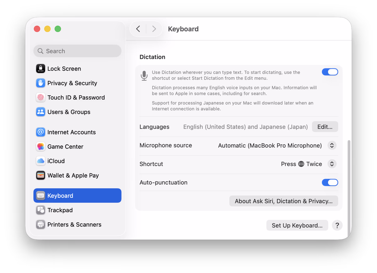 macOS System Settings Keyboard panel showing the Dictation section with toggle, Languages, Microphone source, Shortcut, and Auto-punctuation controls